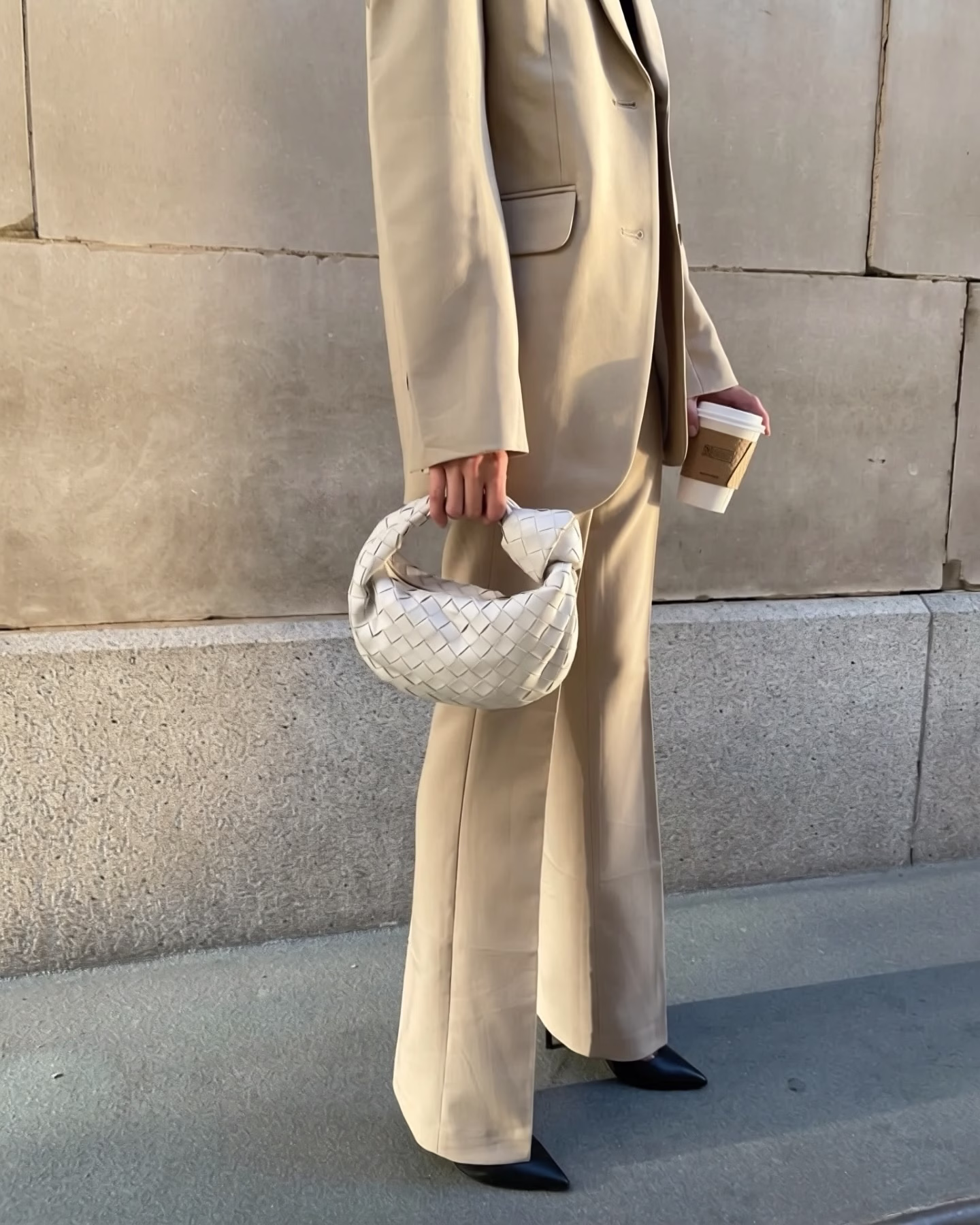 beige suit outfit idea, wearing a white jodie small bag