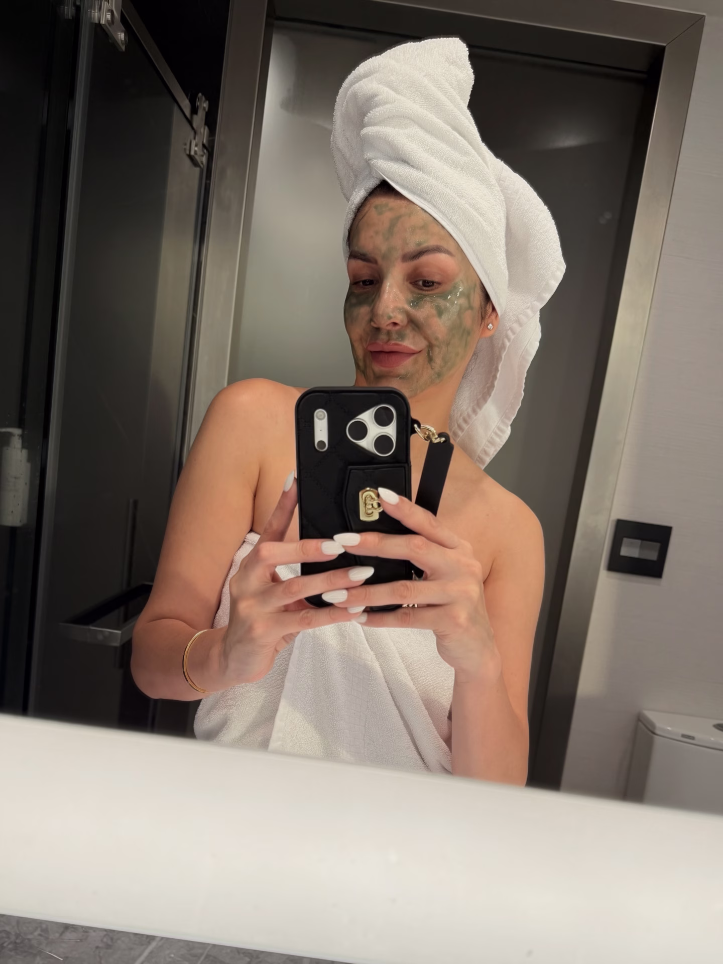 Image of a woman on a selfcare routine with a face mask