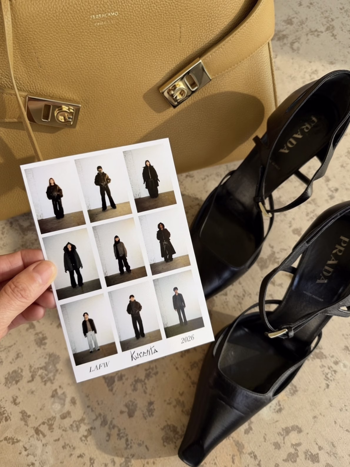 LA Fashion Week 2026 recap. A flat lay of the Ferragamo Hug Bag and Prada black heels showing a picture of outfits