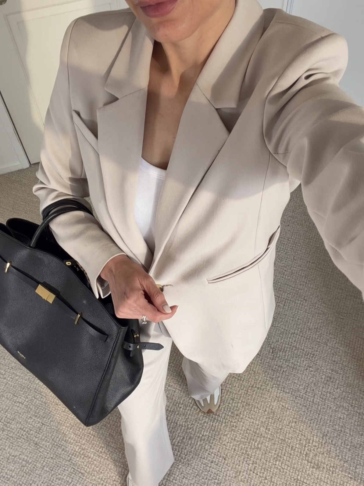 neutral suit with new balance 327 chic office outfit idea with sneakers